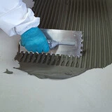 Tiling onto Green Screeds