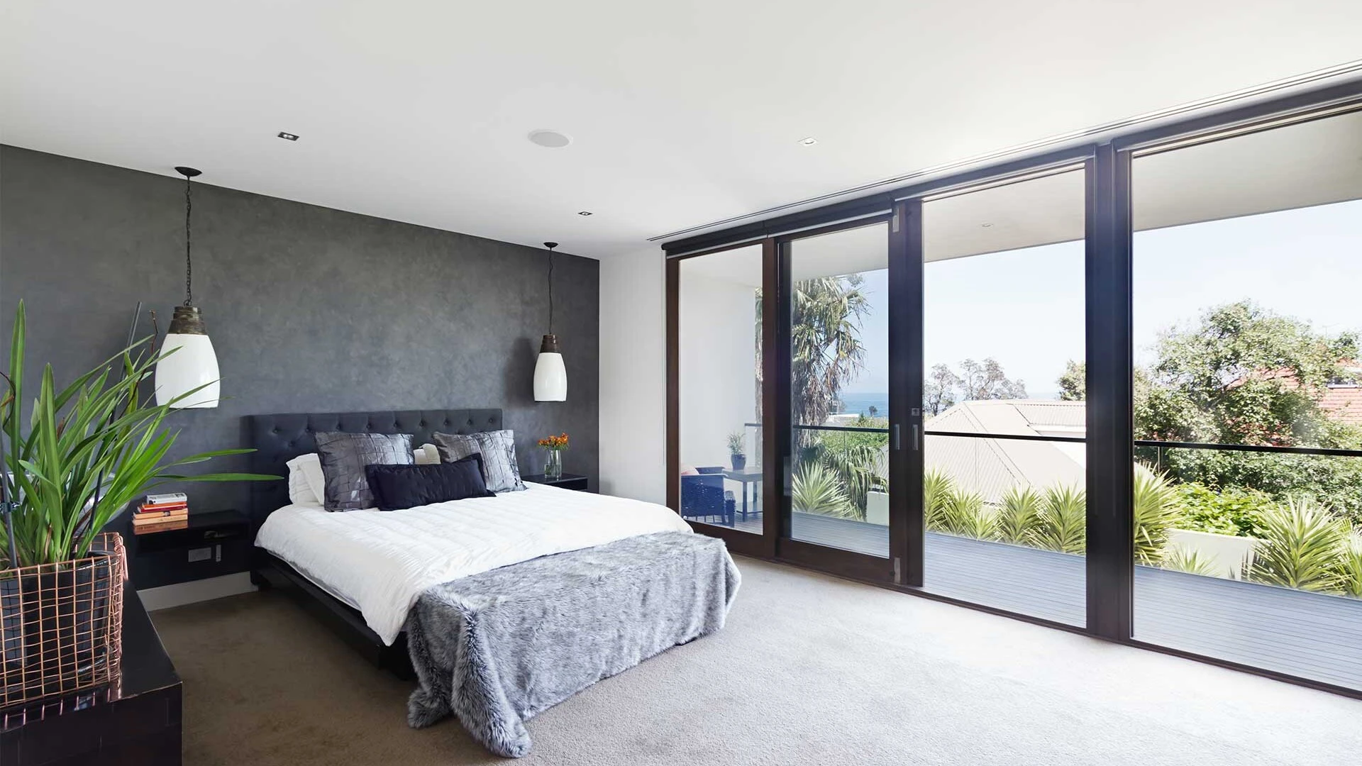 Bright bedroom with grey carpet