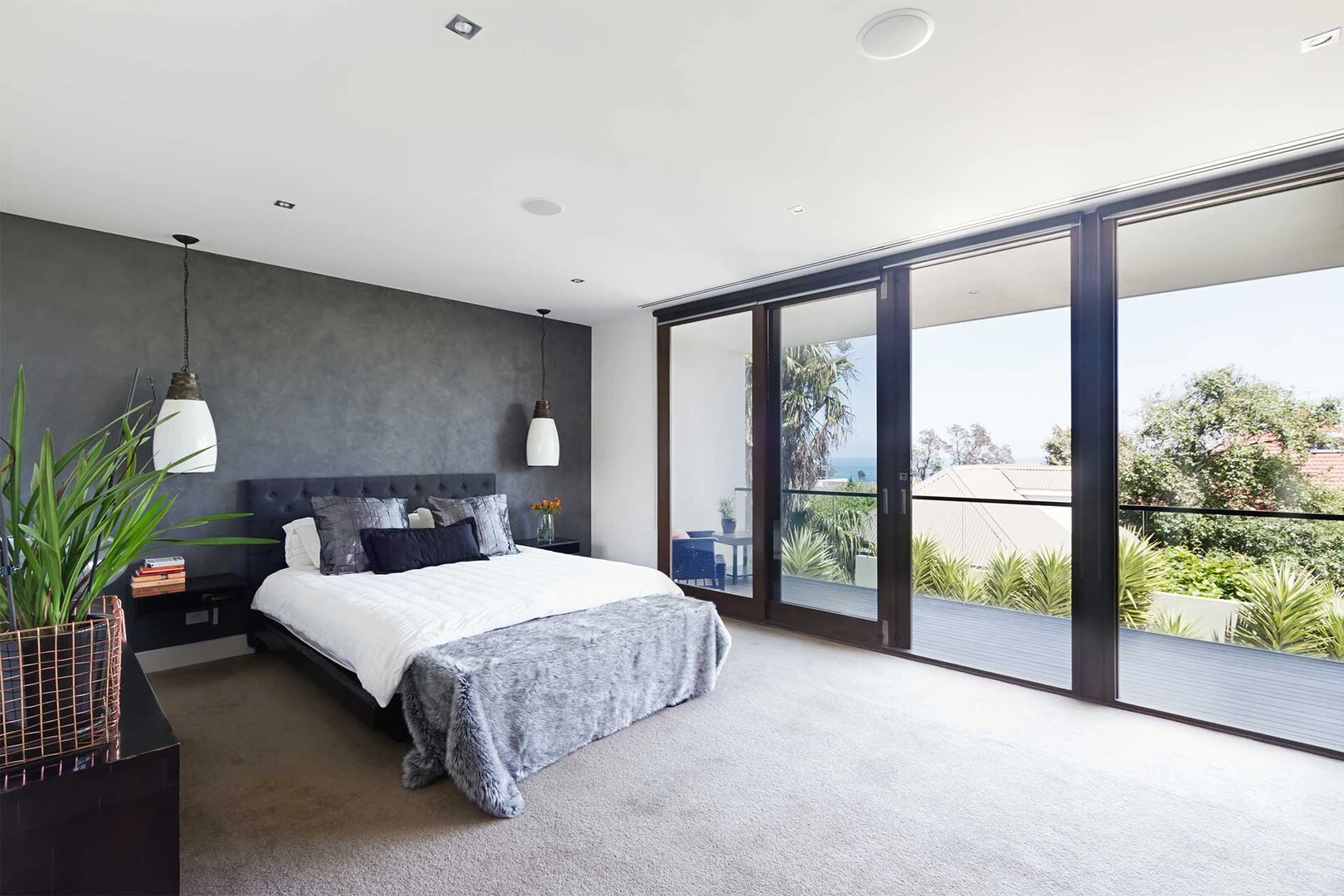 Bright bedroom with grey carpet