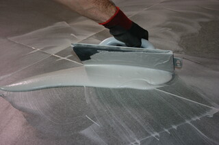 Spreading on tile grout Spreading on tile grout