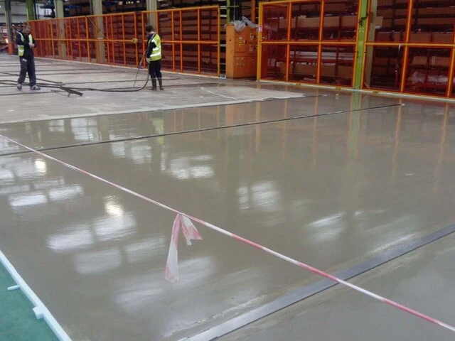 Weber industrial floor screed being pumped at Kawneer UK Ltd