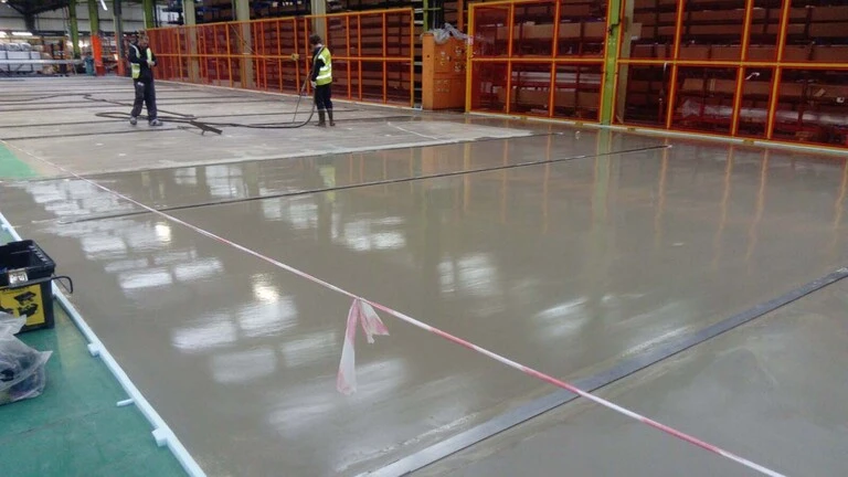 Weber industrial floor screed being pumped at Kawneer UK Ltd