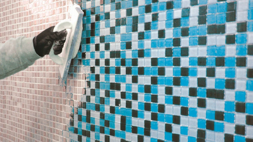 Tiling and grouting swimming pool 